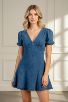 Women’s denim mini dress featuring voluminous puff sleeves and a flirty godet hem for a flattering fit and feminine look, ideal for game day outfits, brunch, and weekend wear.