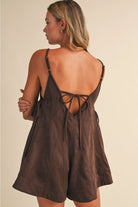 Rear View of of soft textured chocolate brown fabric on a women’s flare romper with subtle stretch