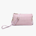 Multi-functional crossbody purse that converts to a wristlet, featuring organized compartments and built-in card slots