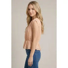 Women's shirred peplum blouse with cap sleeves, round neckline, semi-sheer knit fabric, and flattering fitted bodice.