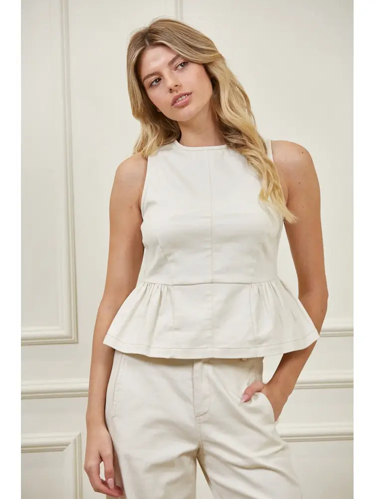 Sleeveless high neck peplum top with fitted bodice, structured woven fabric, vertical seaming, and flared peplum hem