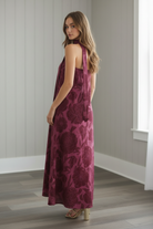 Strapless floral maxi dress with oversized flower print and detachable scarf styled as a halter neck tie
