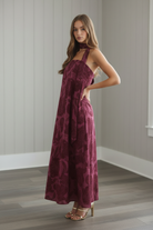 Women’s strapless floral maxi dress with open back, elasticized back detail, oversized floral print, and relaxed fit