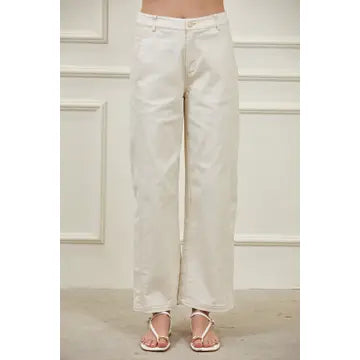 Women’s high-waisted barrel pants in structured woven fabric with tapered leg, visible side seams, and functional pockets