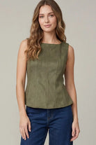 Women's olive suede-feel peplum top styled with jeans for an elevated casual outfit with a fitted waist and flared hem