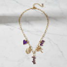 TCU Horned Frogs charm necklace with gold paperclip chain, featuring purple heart, TCU logo, bow, and “Frogs” script charms in 18K triple plated gold