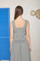 Two-piece black summer set with sleeveless top and high waist skirt