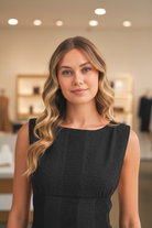 Modern boutique mini dress with textured jacquard fabric, moderate stretch, sleeveless fitted bodice, and feminine polka dot bow tie back. Perfect young contemporary game day outfit for tailgates, football games, and weekend celebrations from Thread Bar Boutique.