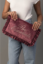 Thread Bar Boutique feminine pink velvet travel organizer with ruffle trim and embroidered “The Essentials” or “Girly Things” design, perfect for makeup, toiletries, chargers, and weekend getaways