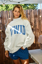 Reversible faith sweatshirt featuring WWJD and AMEN text with oversized fleece fit