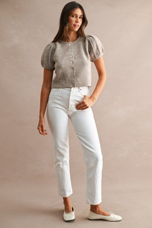 Women's button front sweater styled as a layering piece over a fitted top, featuring short puff sleeves, relaxed fit, crew neckline, and versatile knit construction.
