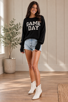 Black Game Day pullover sweater with contrasting white lettering, styled for college football, tailgating, stadium outfits, and team-color game day looks for women from Thread Bar Boutique in Texas