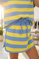 Women's oversized tee and skort matching set with bold stripe print, adjustable drawstring waist, and comfortable stretch fabric. Stylish coordinated outfit for running errands, travel, vacation wardrobes, and effortless everyday fashion.