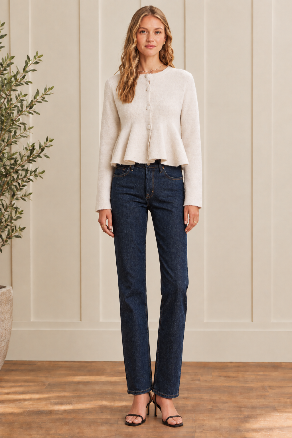 Women's wool-blend peplum sweater cardigan at Thread Bar Boutique with a fitted bodice, flared waistline, covered buttons, round neckline, and slightly cropped silhouette for a polished feminine look.
