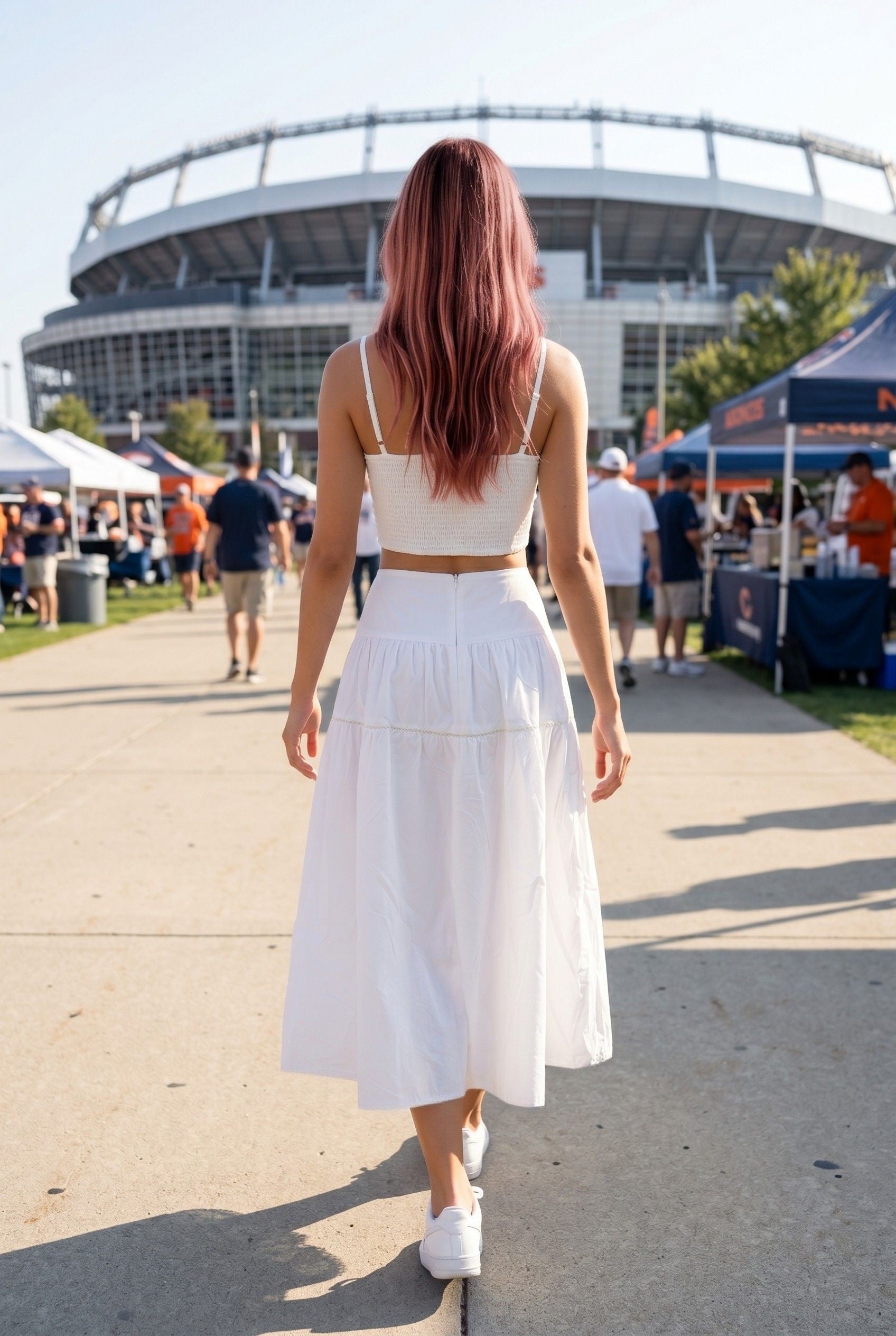 Full front view of a women's white two-piece skirt set with a fitted top, delicate lace trim, and relaxed flowing skirt for an effortlessly polished game day outfit.