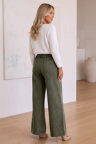 Women’s wide-leg flare pants featuring a relaxed fit through the hip and thigh with a full-length flared leg