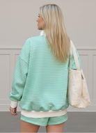 Women’s green striped sweatshirt and shorts set with relaxed oversized fit
