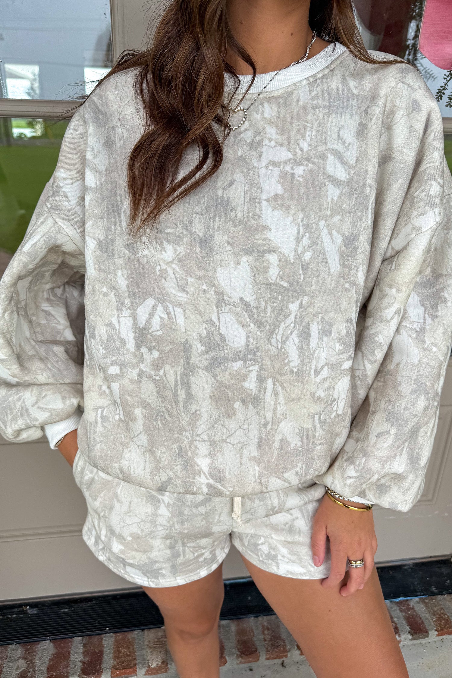 Woodland camouflage loungewear set for women with soft velvety long sleeve top, balloon sleeves, and matching shorts