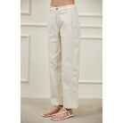 Modern women’s woven barrel pants featuring a high waist, relaxed hip and thigh, tapered hem, and sculptural side panel seams