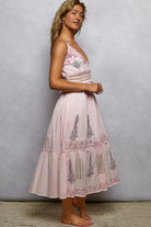 Romantic floral midi dress with smocked waistband from Thread Bar Boutique perfect for weddings or brunch