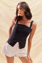 Sleeveless fitted denim top with button-down front, perfect for game day outfits and layering