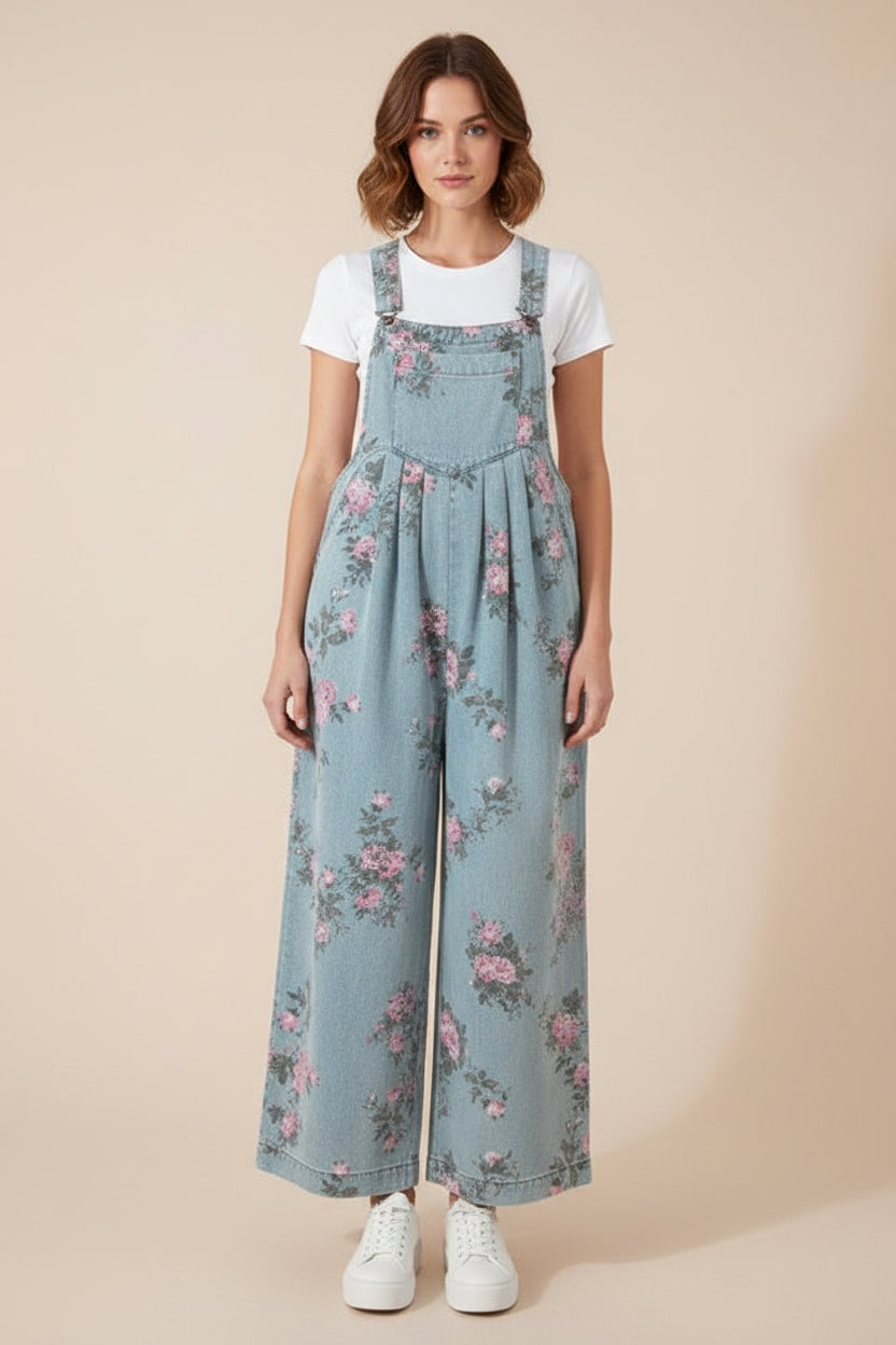 Floral denim wide leg overalls from Thread Bar Boutique featuring pink and sage print, pleated waist detail, and vintage-inspired silhouette.