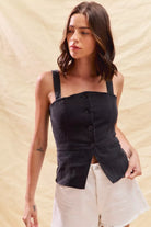 Sleeveless fitted denim top with button-down front, perfect for game day outfits and layering