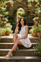 Women’s floral tennis dress with built-in shorts, breathable stretch fabric, and flirty ruffle detail from Thread Bar Boutique