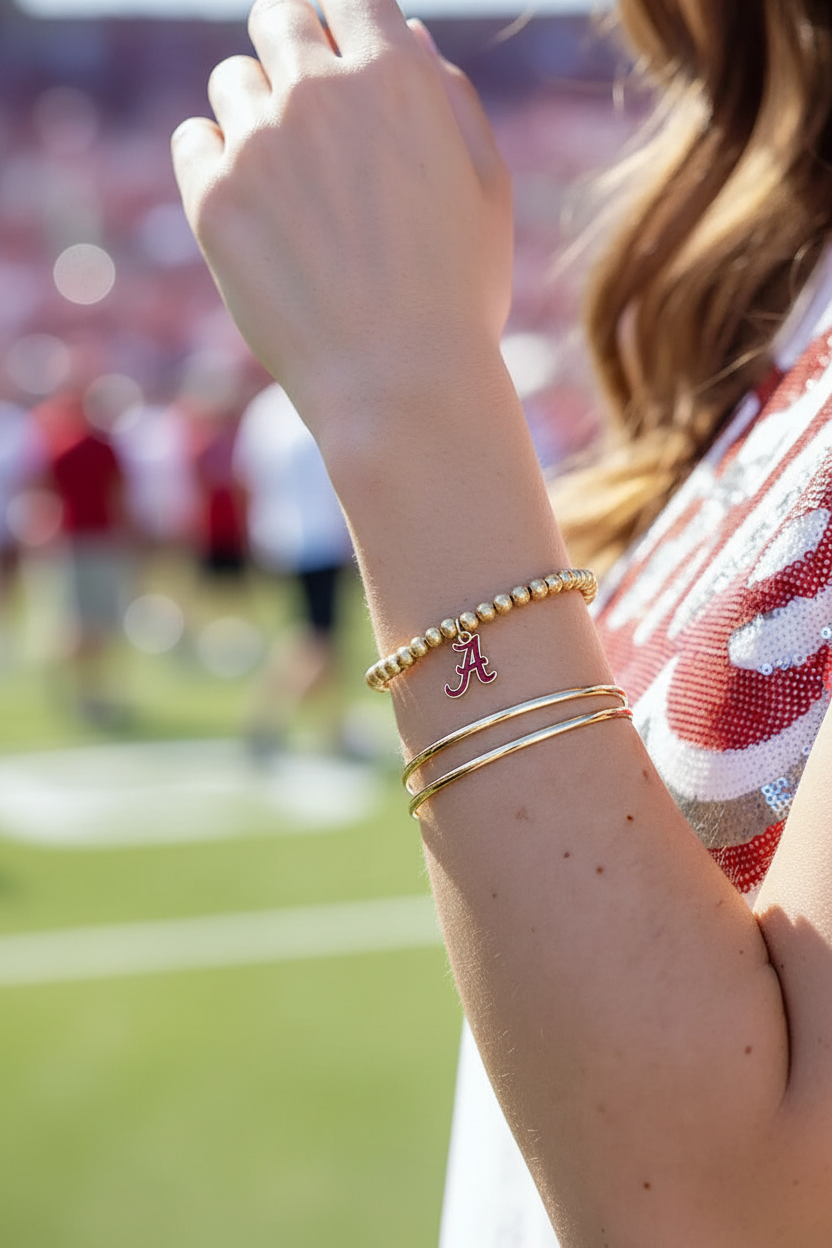 Alabama Crimson Tide Ball Bead Stretch Bracelet - stacked with gold bangles, outdoor game day