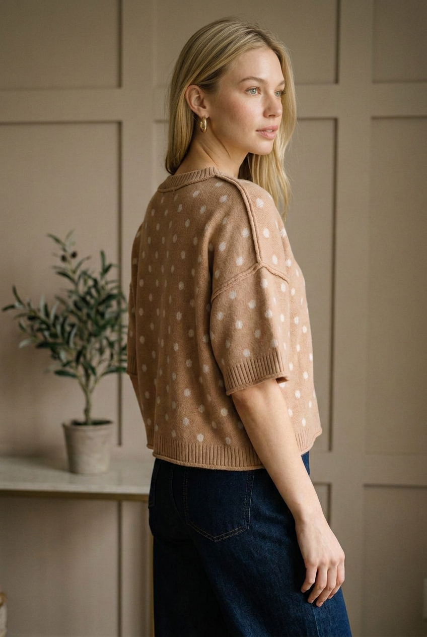 Camel polka dot sweater knit top with wide elbow length sleeves and ribbed cuffs, angled side view