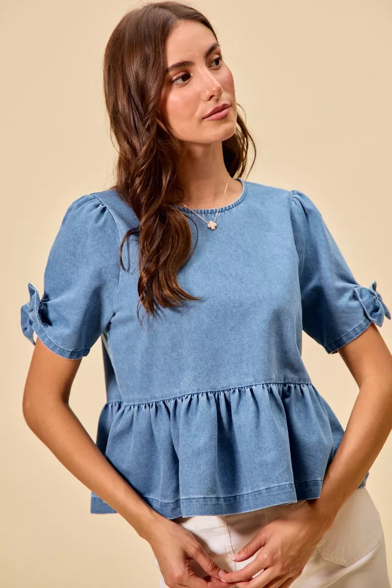 Denim bow detail peplum top from Thread Bar Boutique with flattering waist-defining silhouette front view