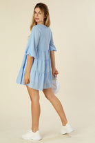 A charming gingham tiered dress featuring a V-neckline, puff 3/4 sleeves, and a flowy tiered silhouette. Fully lined with no stretch, perfect for casual outings, picnics, or brunch dates.