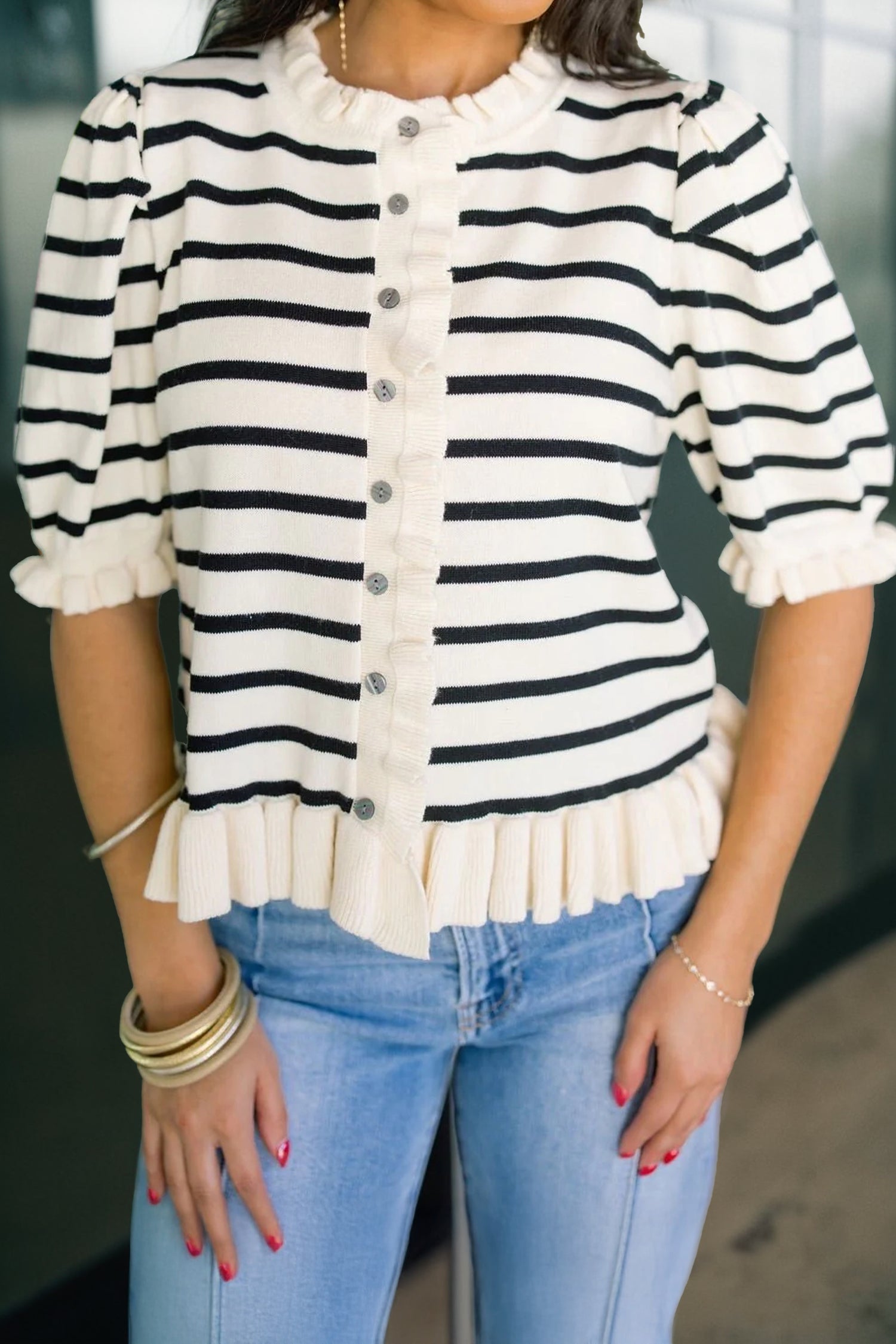Lightweight beige stripe knit cardigan with feminine ruffle trim and short sleeves
