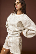 Camo high-waisted drawstring shorts, part of a coordinated camo sweat set with a matching crewneck