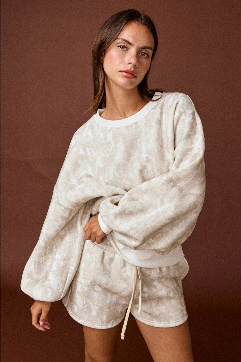 Camo high-waisted drawstring shorts, part of a coordinated camo sweat set with a matching crewneck