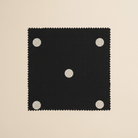 Black fabric with white polka dots flat lay swatch