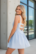 rear  view of Stylish gingham tennis style dress with built-in shorts from Thread Bar Boutique perfect for active lifestyle