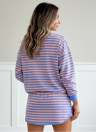 Blue stripe two-piece set with relaxed pullover and high-waist mini skort
