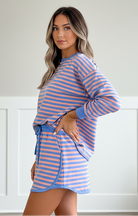 Women’s blue striped pullover and mini skort set with built-in shorts