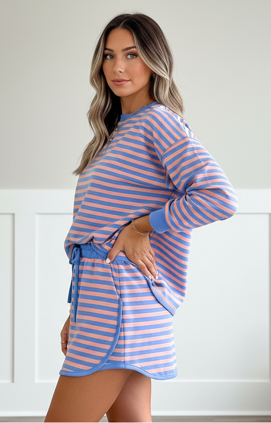 Women’s blue striped pullover and mini skort set with built-in shorts