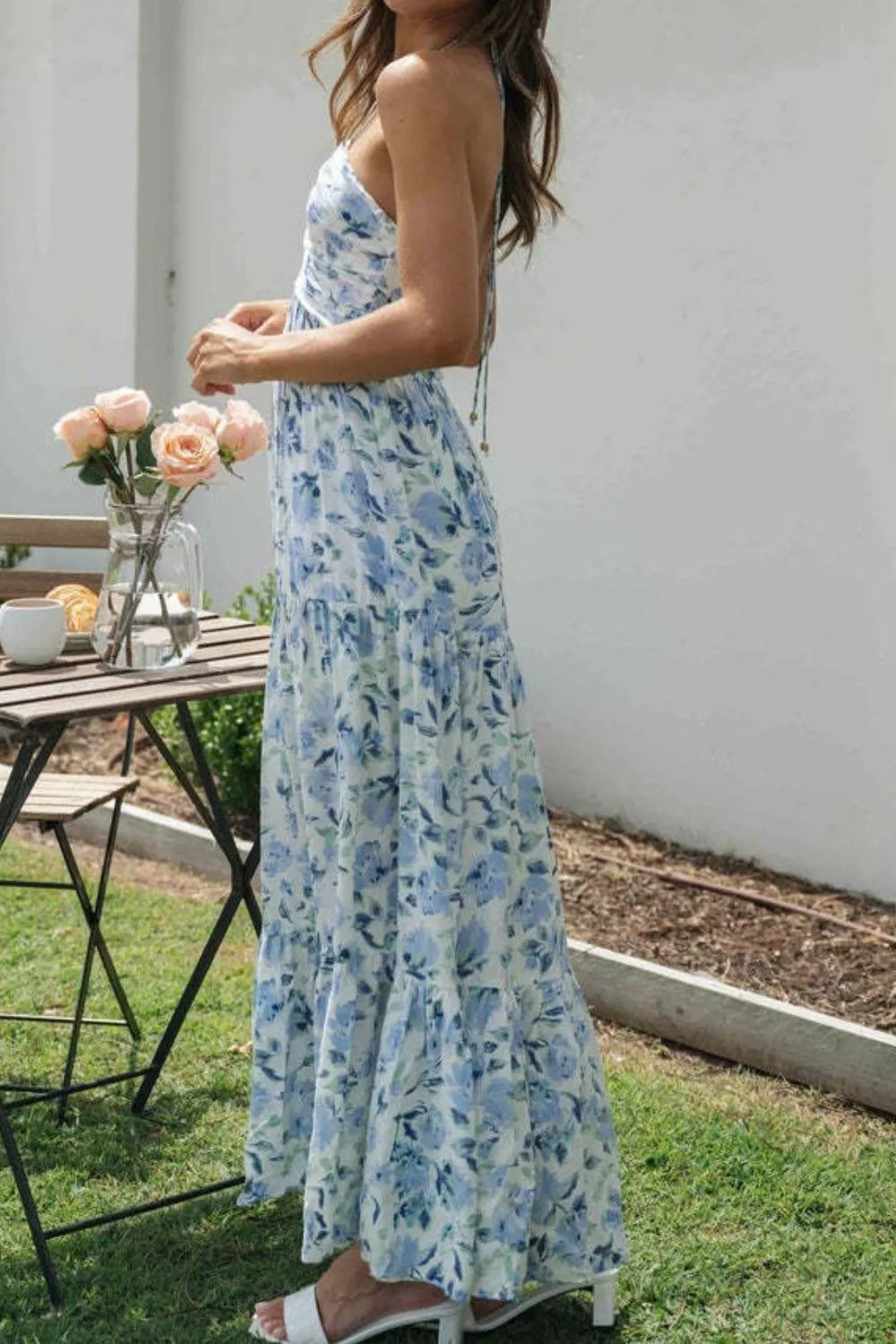 Floral halter midi dress from Thread Bar Boutique featuring ruched front, open tie back, and flowy feminine silhouette