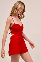 Fitted Game Day romper with lace-up open back design
