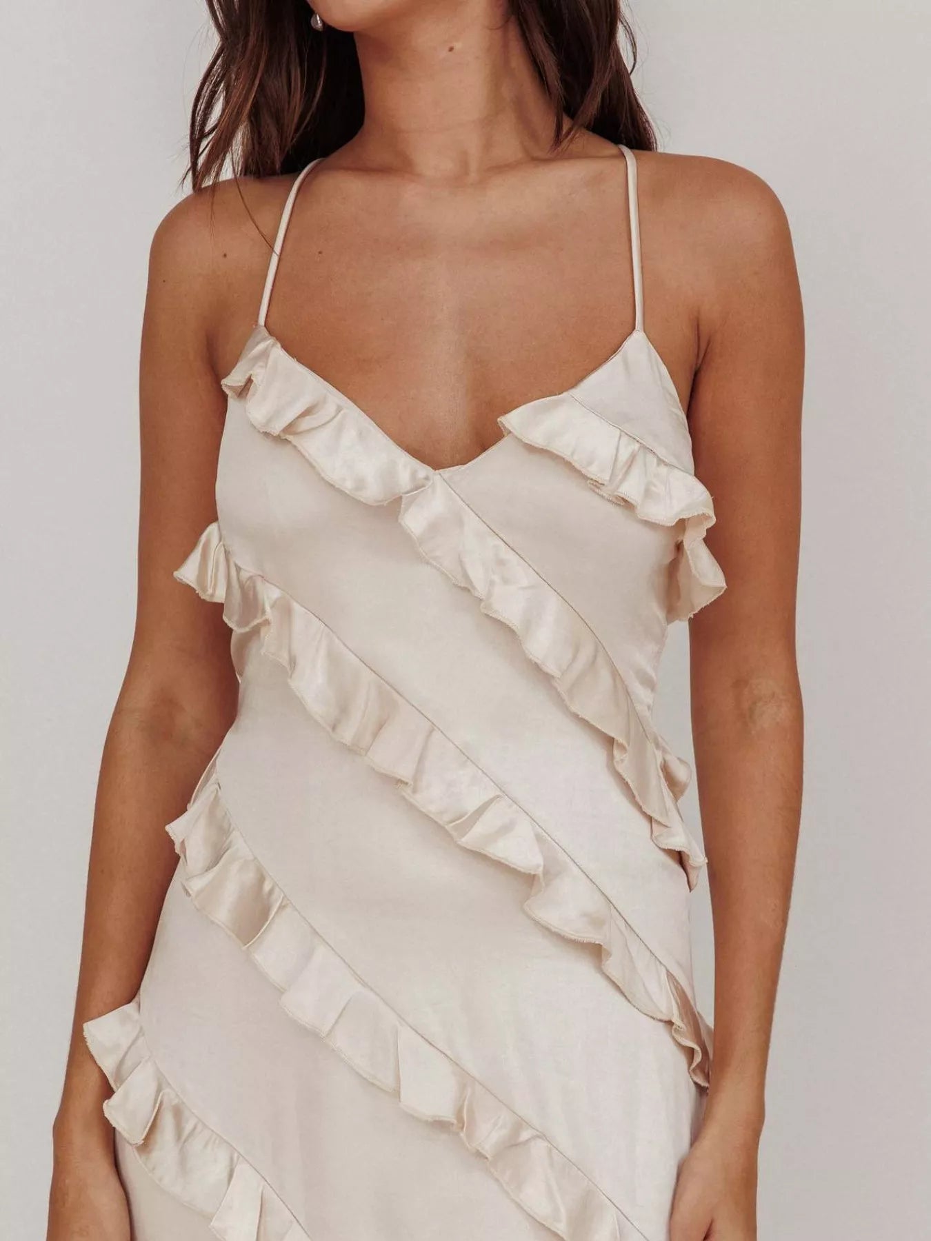 close up cream Ruffled spaghetti strap maxi dress with flowy silhouette, lightweight fabric, and feminine drape