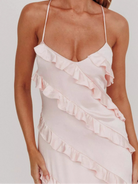 Ruffled spaghetti strap maxi dress with flowy silhouette, lightweight fabric, and feminine drape close up