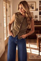 Women’s olive corduroy vest with scalloped trim and classic button front design