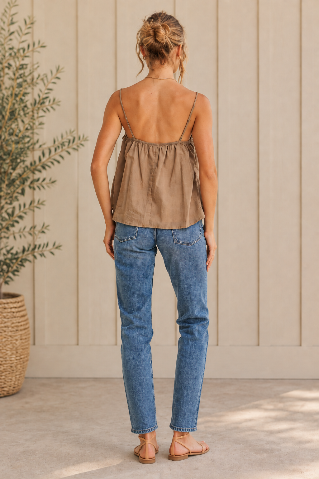 Back view of mocha floral lace cotton flare cami with adjustable straps and neutral sandals