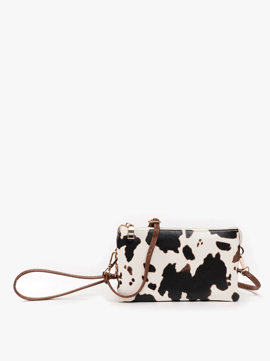 riley cow print vegan cross body wristlet
