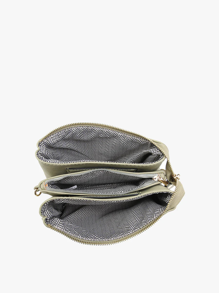 riley cow print vegan cross body wristlet interior