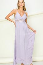 Model wearing an elegant lace maxi dress with a bustier-style bodice and flowing skirt, styled for a romantic formal occasion.