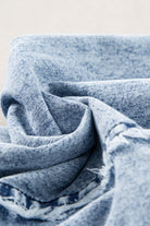 Casual chic wide leg overalls from Thread Bar Boutique in light wash denim with unique reverse seams and playful frayed detailing fabric close up